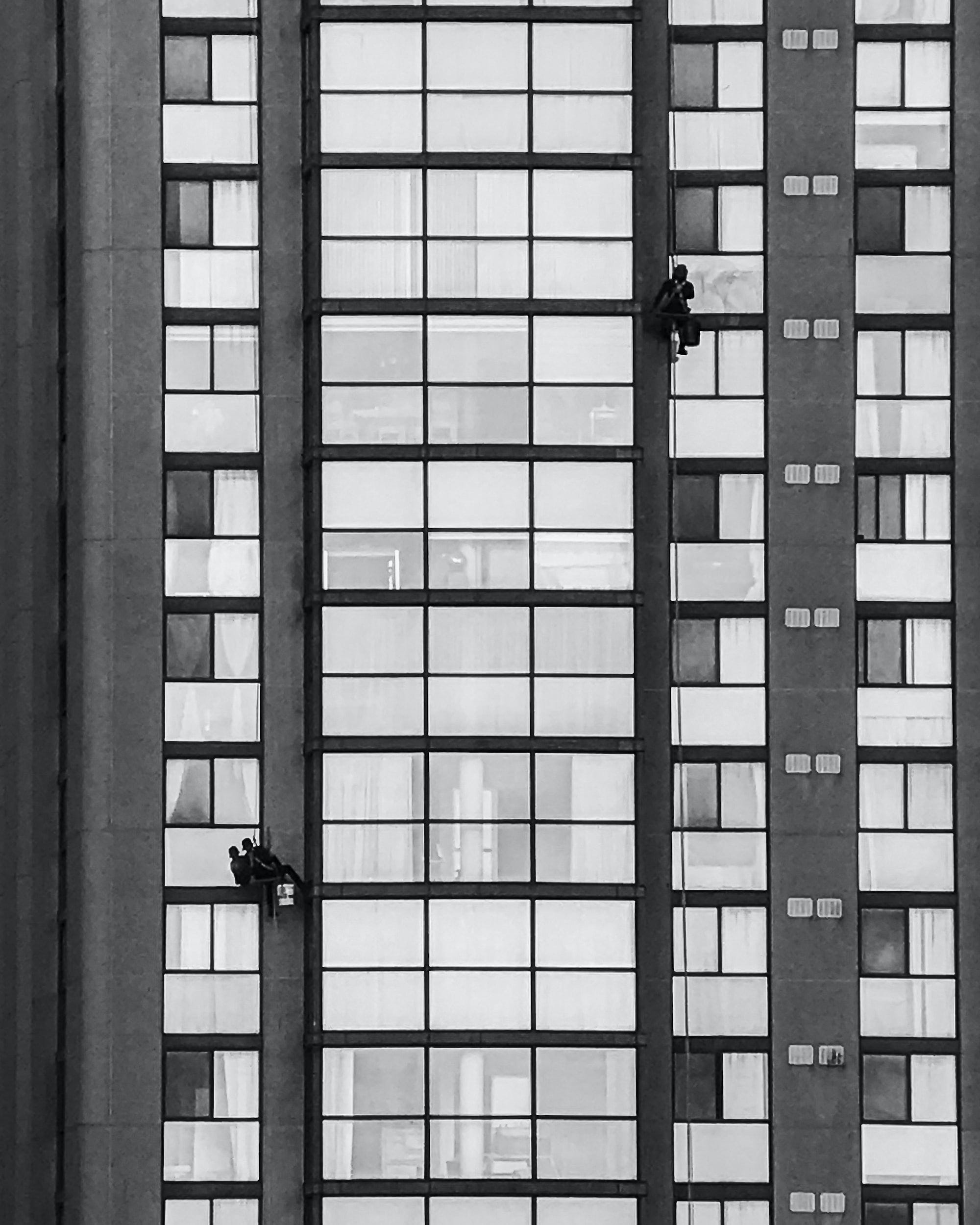 Window washers cleaning the windows of a high rise building.